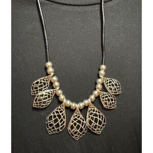 Y56 Silvertone leaves on long black cord necklace